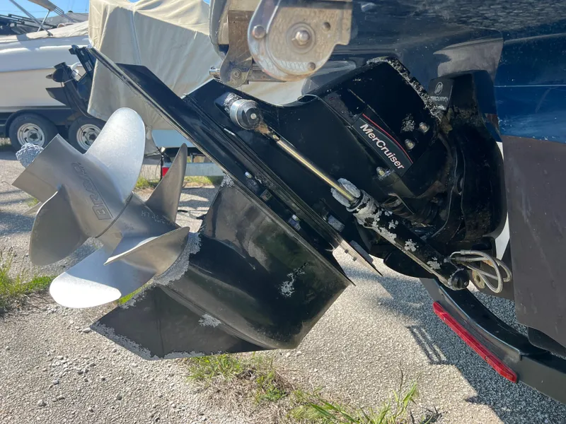 Slide: The Image of Outboard motor of a 2020 Sea Ray SPX 230 boat with dual propellers. - 13