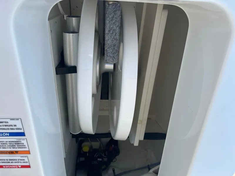 Slide: The Image of Interior view of 2020 Sea Ray SPX 230 boat compartment with mechanical components. - 16