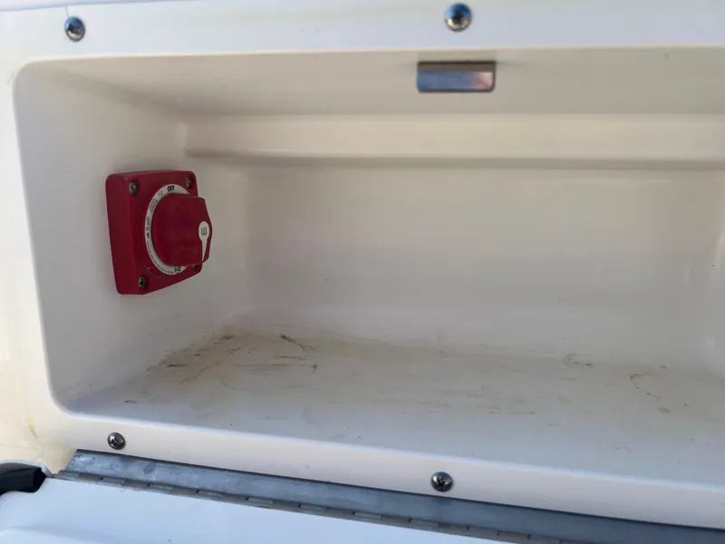 Slide: The Image of Battery switch compartment in a 2020 Sea Ray SPX 230 boat. - 18