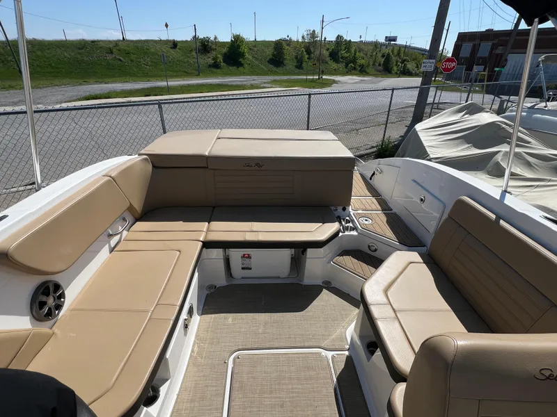 Slide: The Image of 2020 Sea Ray SPX 230 boat interior with tan seating and spacious layout. - 5