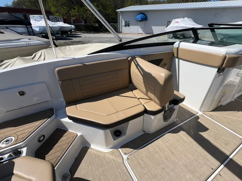 Slide: The Image of 2020 Sea Ray SPX 230 boat interior with tan seating and modern design. - 6