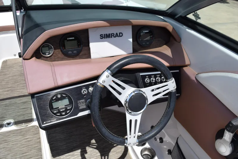 Slide: The Image of Steering wheel and dashboard of 2018 Four Winns HD240 OB boat. - 10