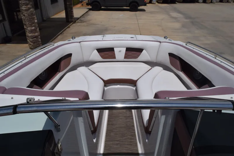 Slide: The Image of 2018 Four Winns HD240 OB boat interior with white and brown seating. - 9