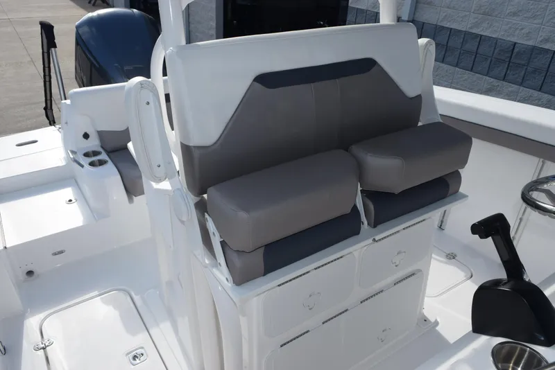 Slide: The Image of 2025 Hurricane Center Console 24 OB boat interior with cushioned seating and storage compartments. - 12