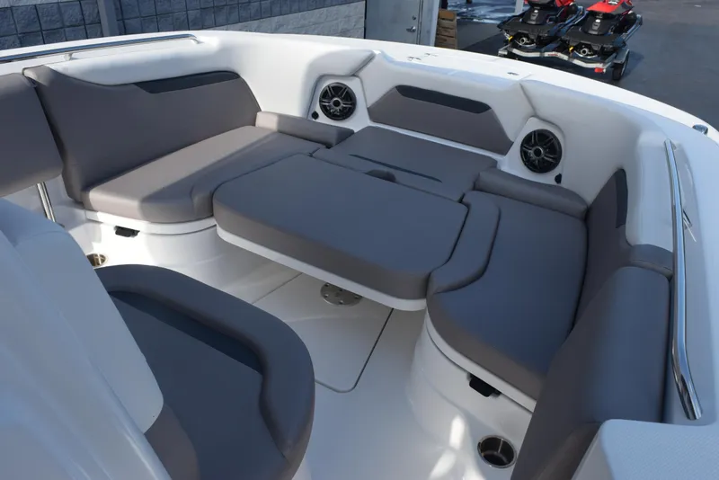 Slide: The Image of 2025 Hurricane Center Console 24 OB boat interior with gray seating and speakers. - 13
