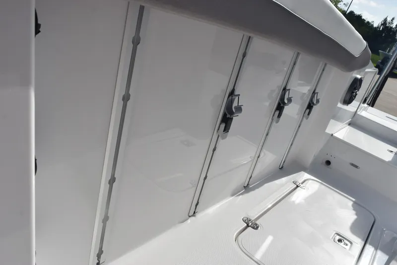 Slide: The Image of 2025 Hurricane Center Console 24 OB boat storage compartments and deck view. - 16