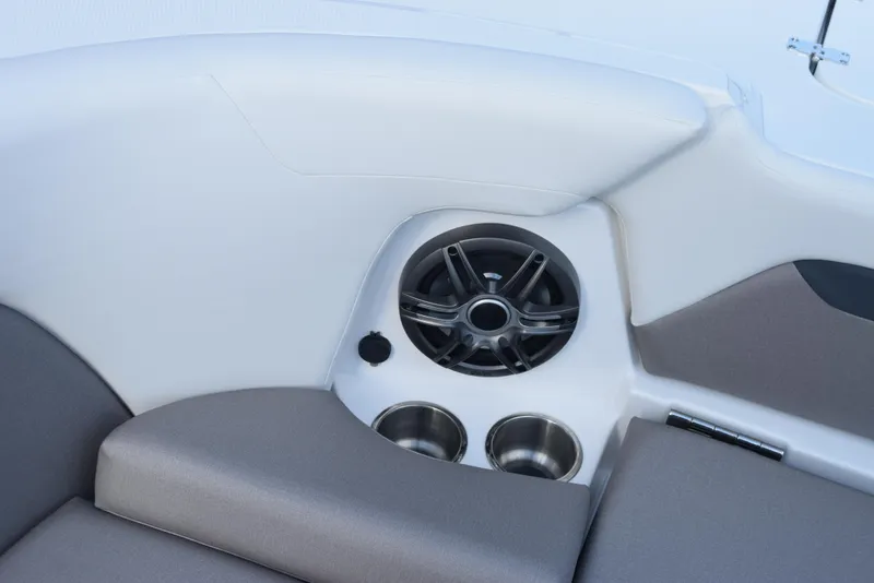 Slide: The Image of 2025 Hurricane Center Console 24 OB boat interior with speaker and cup holders. - 18