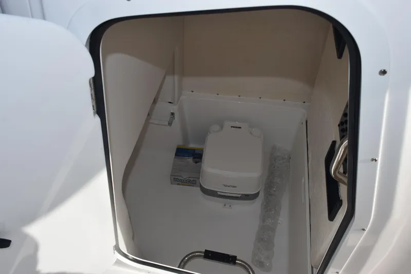 Slide: The Image of 2025 Hurricane Center Console 24 OB boat storage compartment with portable toilet. - 20