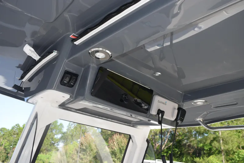 Slide: The Image of 2025 Hurricane Center Console 24 OB boat interior with modern electronics and sleek design. - 24