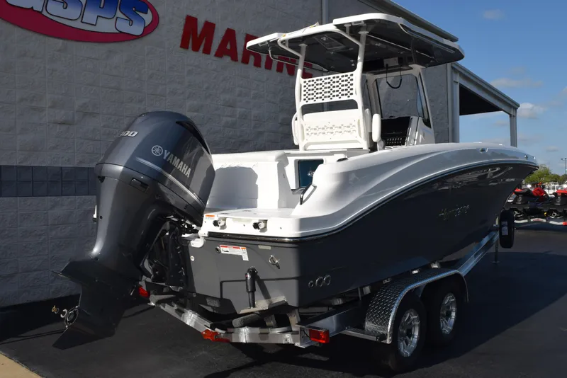 Slide: The Image of 2025 Hurricane Center Console 24 OB boat with Yamaha outboard motor on a trailer. - 4
