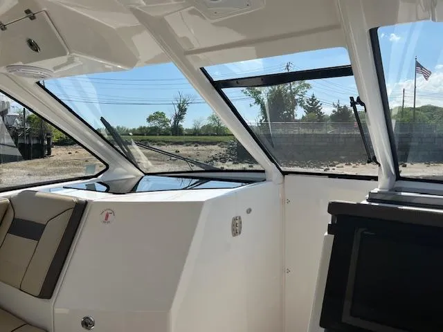 Slide: The Image of 2019 Pursuit DC 365 Dual Console interior with sleek design and large windows. - 26