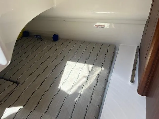 Slide: The Image of Interior cabin of 2019 Pursuit DC 365 Dual Console boat with cushioned seating. - 31