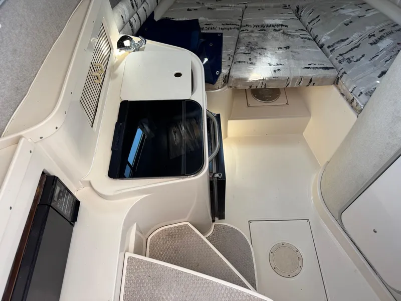 Slide: The Image of 1990 Grady-White Marlin 28 cabin interior with seating and storage. - 11