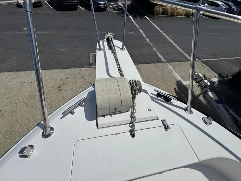 Slide: The Image of Bow of 1990 Grady-White Marlin 28 with anchor chain and railing. - 25