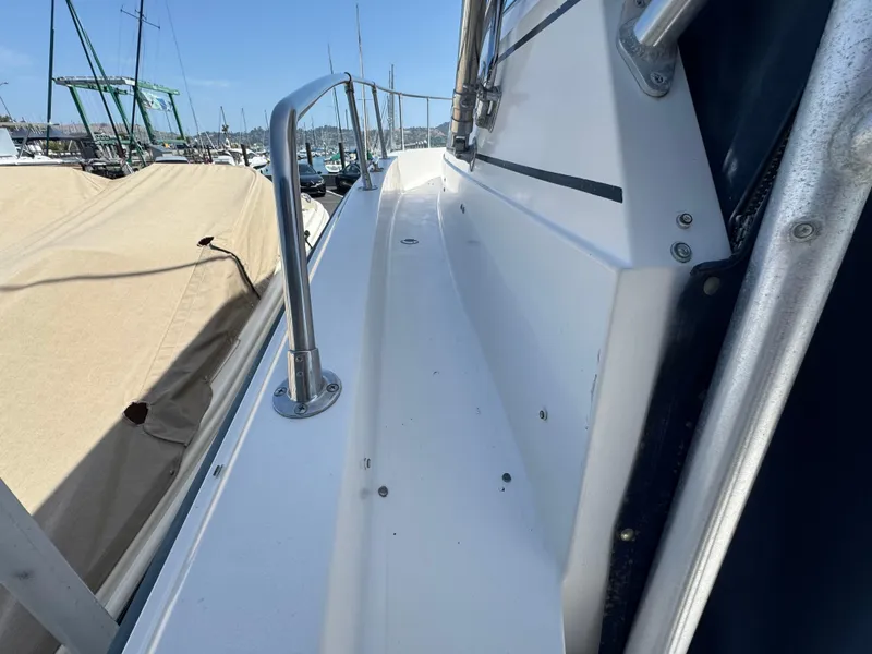 Slide: The Image of 1990 Grady-White Marlin 28 boat deck with railing, docked at marina. - 26