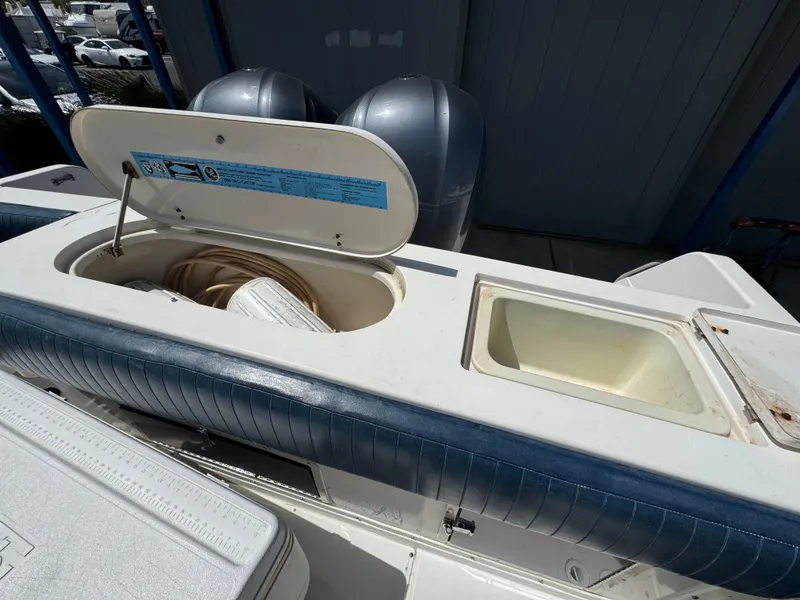 Slide: The Image of 1990 Grady-White Marlin 28 boat interior with storage compartments and seating. - 27