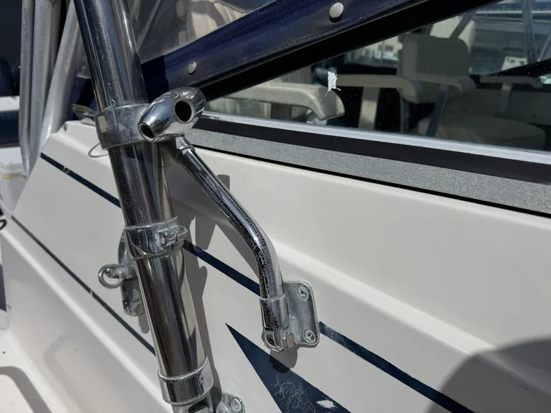 Slide: The Image of Close-up of a 1990 Grady-White Marlin 28 boat's metal fittings and window frame. - 28