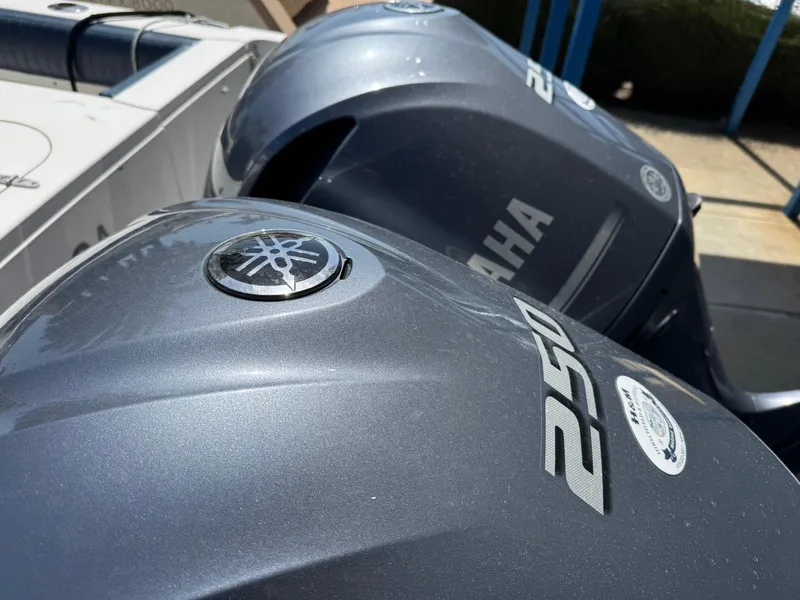 Slide: The Image of Twin Yamaha 250 outboard motors on a 1990 Grady-White Marlin 28 boat. - 32