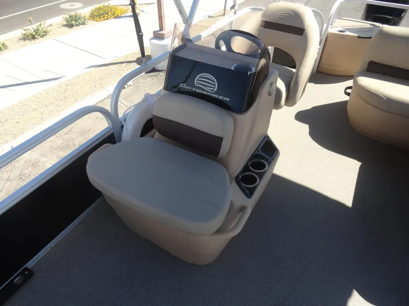 Slide: The Image of 2019 Sun Tracker Bass Buggy 18 DLX boat interior with seating and steering console. - 14