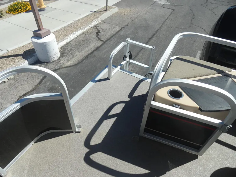 Slide: The Image of 2019 Sun Tracker Bass Buggy 18 DLX pontoon boat deck with seating and railing. - 19