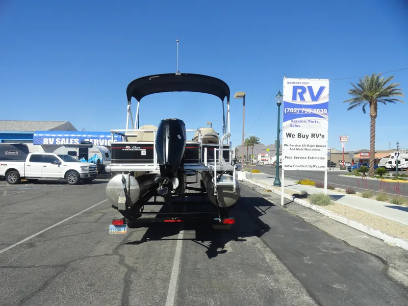 Slide: The Image of 2019 Sun Tracker Bass Buggy 18 DLX pontoon boat parked at RV sales lot. - 21