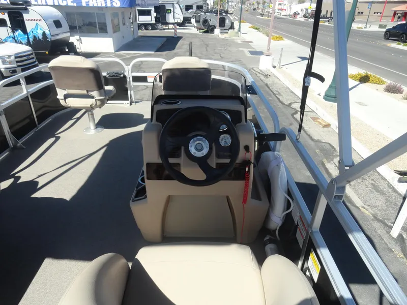 Slide: The Image of 2019 Sun Tracker Bass Buggy 18 DLX pontoon boat interior with steering console and seating. - 9