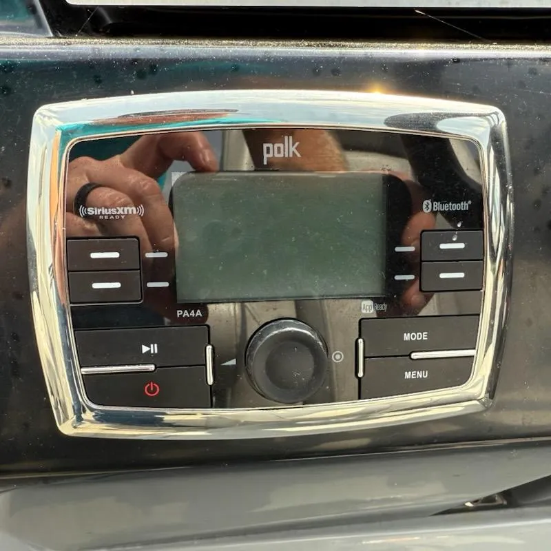 Slide: The Image of Polk audio system on 2019 Godfrey Aqua Patio 235 UL boat dashboard. - 15