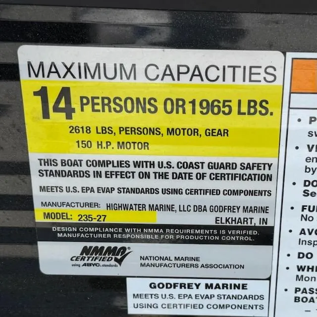 Slide: The Image of 2019 Godfrey Aqua Patio 235 UL capacity label: 14 persons or 1965 lbs, 150 HP motor. - 16