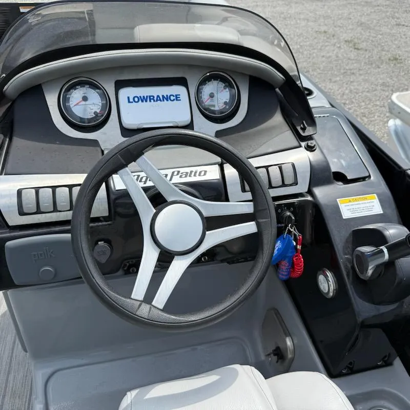 Slide: The Image of Steering console of 2019 Godfrey Aqua Patio 235 UL with Lowrance display and gauges. - 9