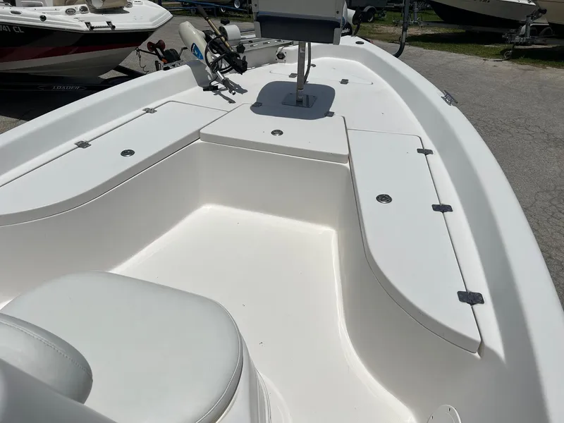 Slide: The Image of 2006 NauticStar 2110 Nautic Bay boat interior with seating and storage compartments. - 10