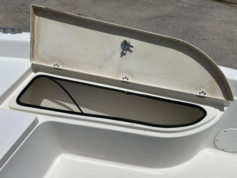 Slide: The Image of Open storage compartment on a 2006 NauticStar 2110 Nautic Bay boat. - 13