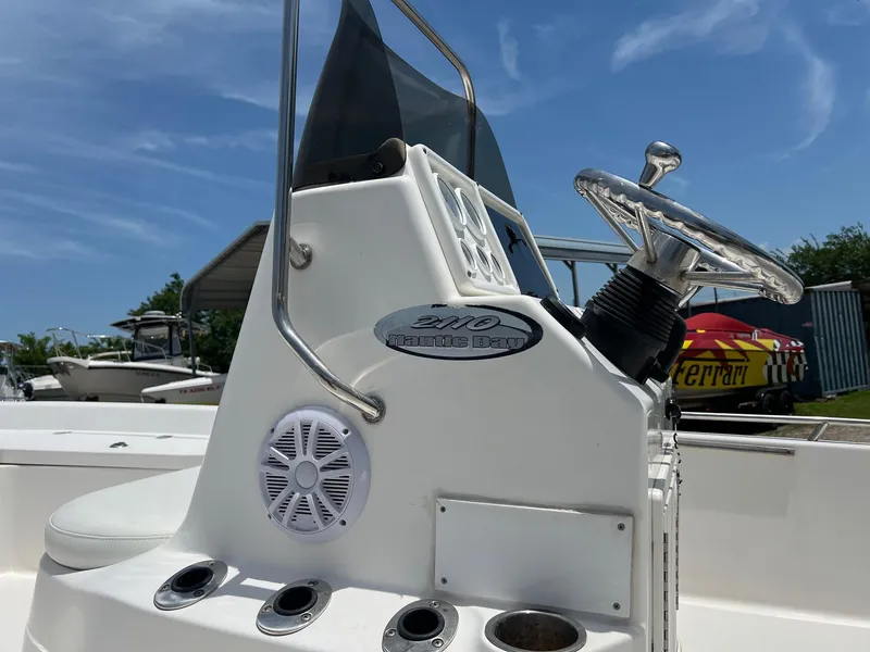 Slide: The Image of 2006 NauticStar 2110 Nautic Bay boat console with steering wheel and speaker. - 2