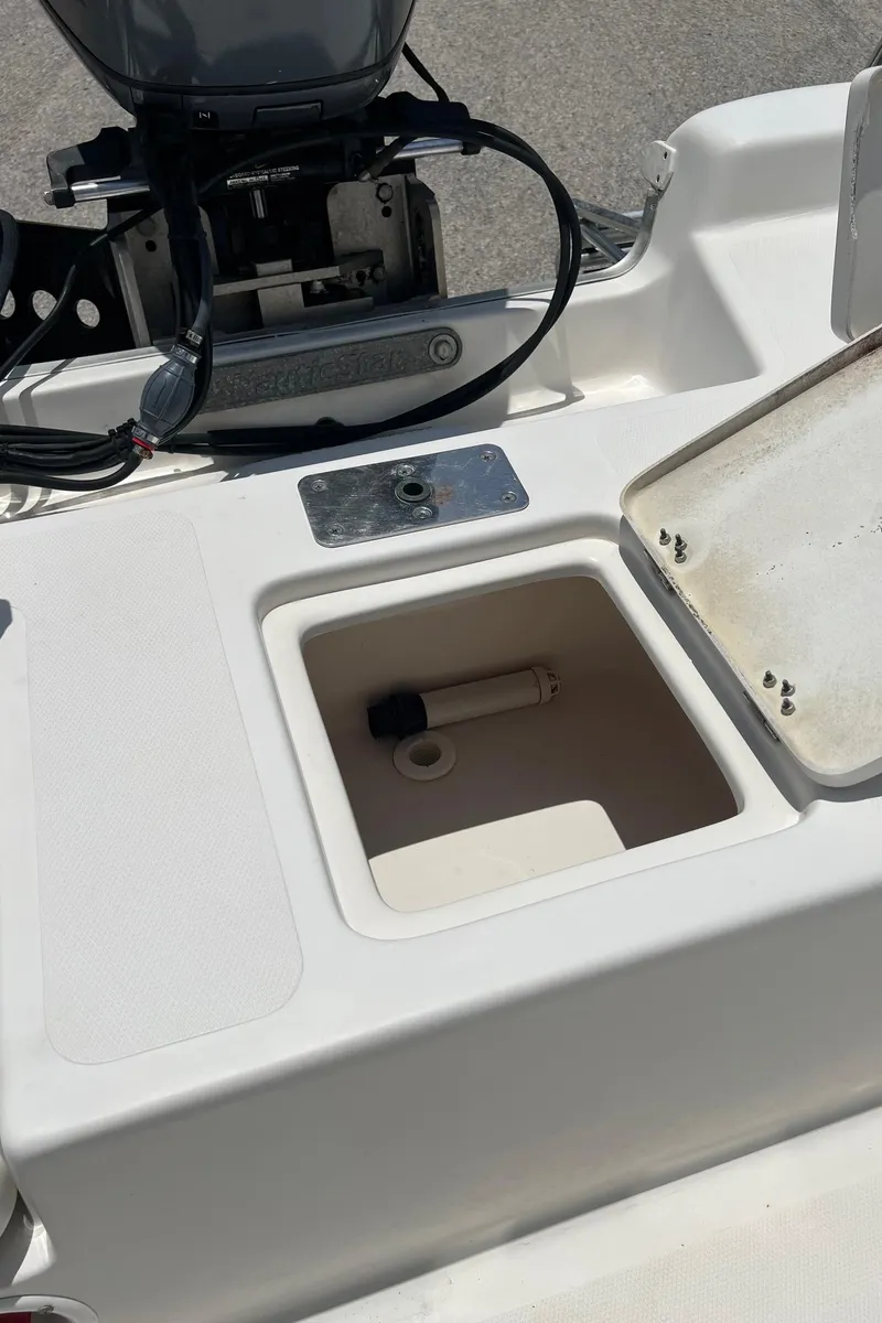 Slide: The Image of 2006 NauticStar 2110 Nautic Bay boat with open storage compartment. - 22