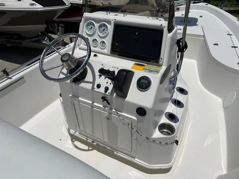 Slide: The Image of 2006 NauticStar 2110 Nautic Bay boat console with steering wheel and gauges. - 6