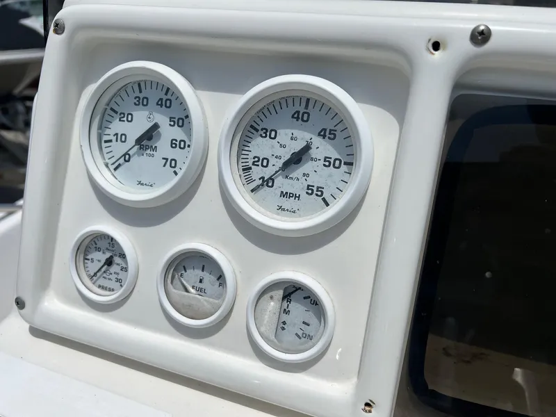 Slide: The Image of Dashboard gauges of a 2006 NauticStar 2110 Nautic Bay boat, displaying speed and fuel levels. - 8