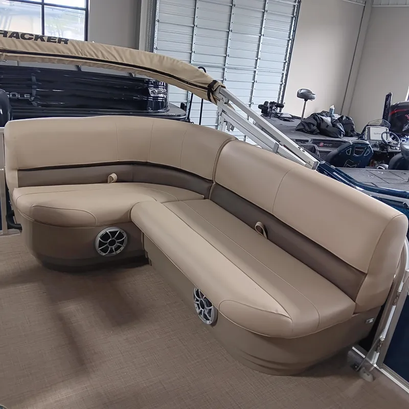 Slide: The Image of 2025 Sun Tracker Bass Buggy 16 XL Select with beige seating in a showroom. - 9