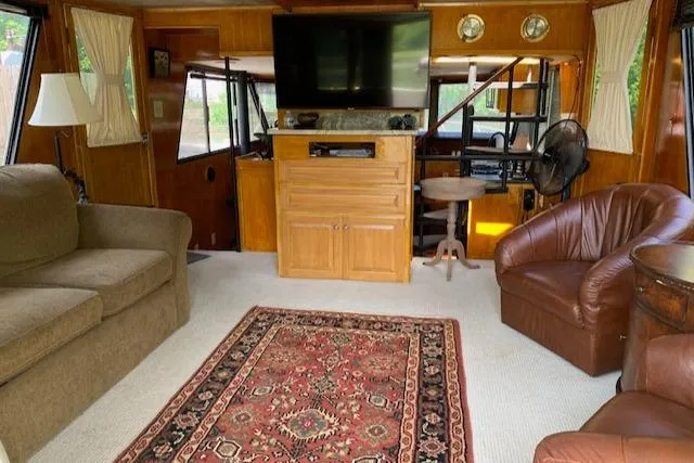 Slide: The Image of Interior of 1991 King's Craft 48 Motor Yacht with carpet and leather chairs. - 12