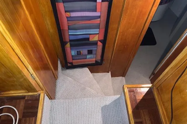 Slide: The Image of Interior of 1991 King's Craft 48 Motor Yacht with carpeted stairs. - 19