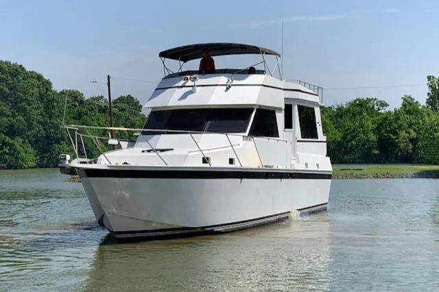 Slide: The Image of 1991 King's Craft 48 Motor Yacht cruising on calm waters. - 2