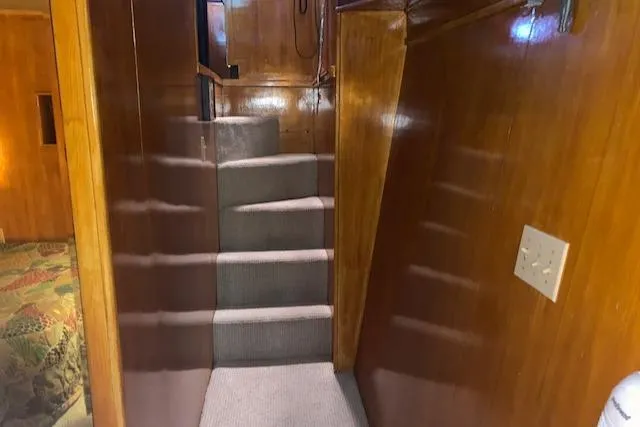 Slide: The Image of Interior of 1991 King's Craft 48 Motor Yacht with carpeted stairs. - 22