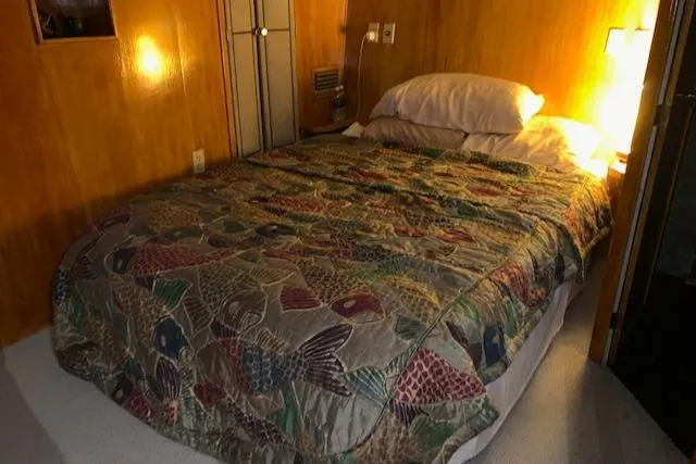 Slide: The Image of Bedroom in 1991 King's Craft 48 Motor Yacht with cozy bed. - 23