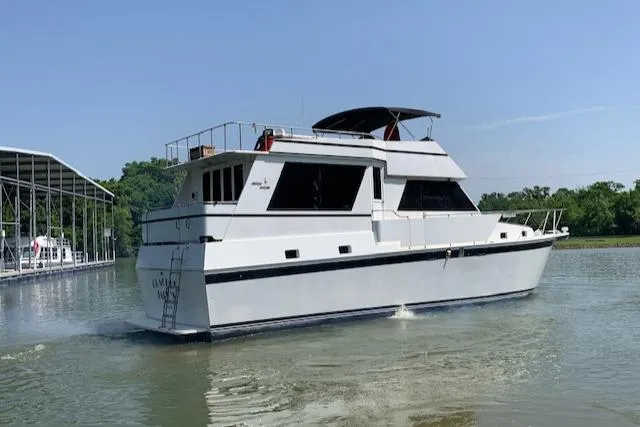 Slide: The Image of 1991 King's Craft 48 Motor Yacht on calm water. - 6