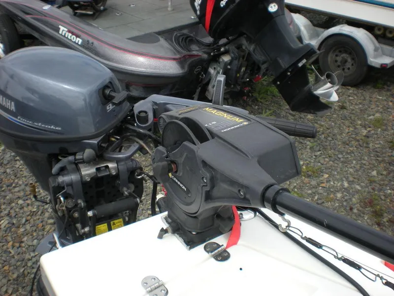 Slide: The Image of 2010 Arima SEA CHASER boat with Yamaha outboard motor and fishing equipment. - 9