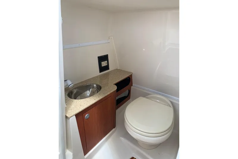 Slide: The Image of Interior of 2012 Monterey M5 MSX Sport Boat bathroom with sink and toilet. - 16