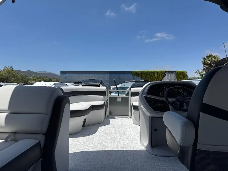 Slide: The Image of 2025 South Bay 18CR SE S Cruise pontoon boat interior with modern seating and dashboard. - 14