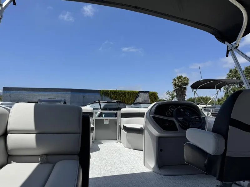 Slide: The Image of 2025 South Bay 18CR SE S Cruise pontoon boat interior under blue sky. - 16