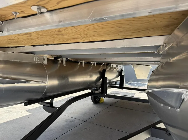 Slide: The Image of Underneath view of 2025 South Bay 18CR SE S Cruise pontoon boat on trailer. - 24