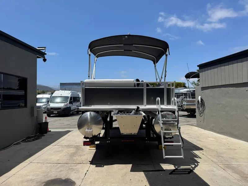 Slide: The Image of 2025 South Bay 18CR SE S Cruise pontoon boat in a sunny outdoor setting. - 26