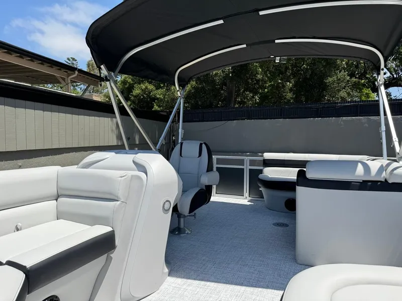 Slide: The Image of 2025 South Bay 18CR SE S Cruise pontoon boat with spacious seating and canopy. - 6