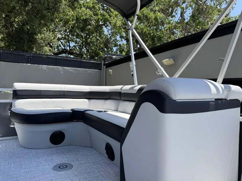 Slide: The Image of 2025 South Bay 18CR SE S Cruise pontoon boat interior with cushioned seating. - 8
